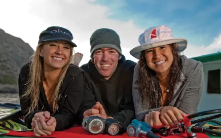 Divemaster interns relaxed on a dive boat after training
